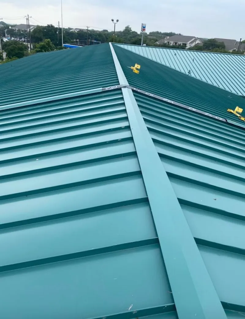 Green commercial metal roof ridge and valley for Metal Roof Repair in Peoria Heights