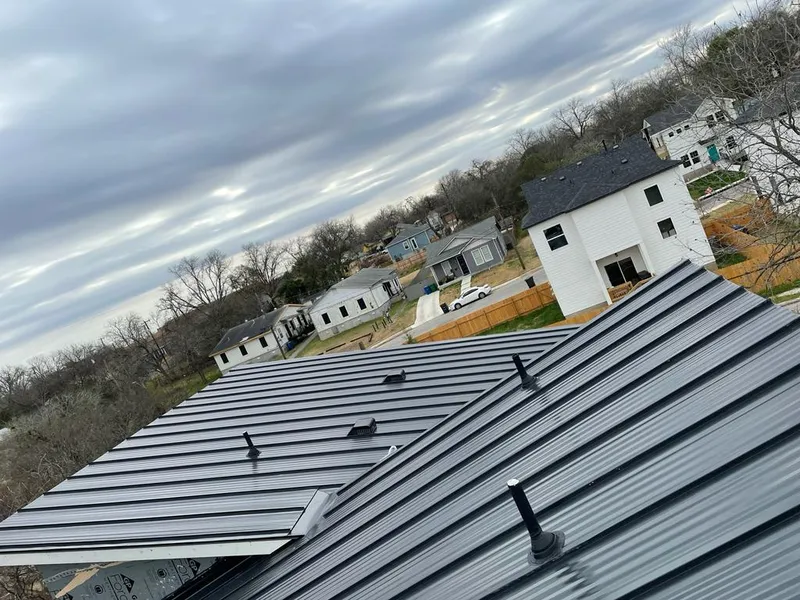 Standing seam metal roof panels with vents for Skylight Repair in Peoria Heights
